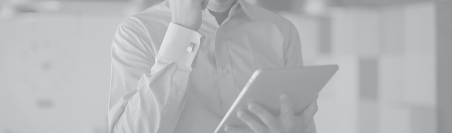 lawyer talking on the phone while looking at tablet